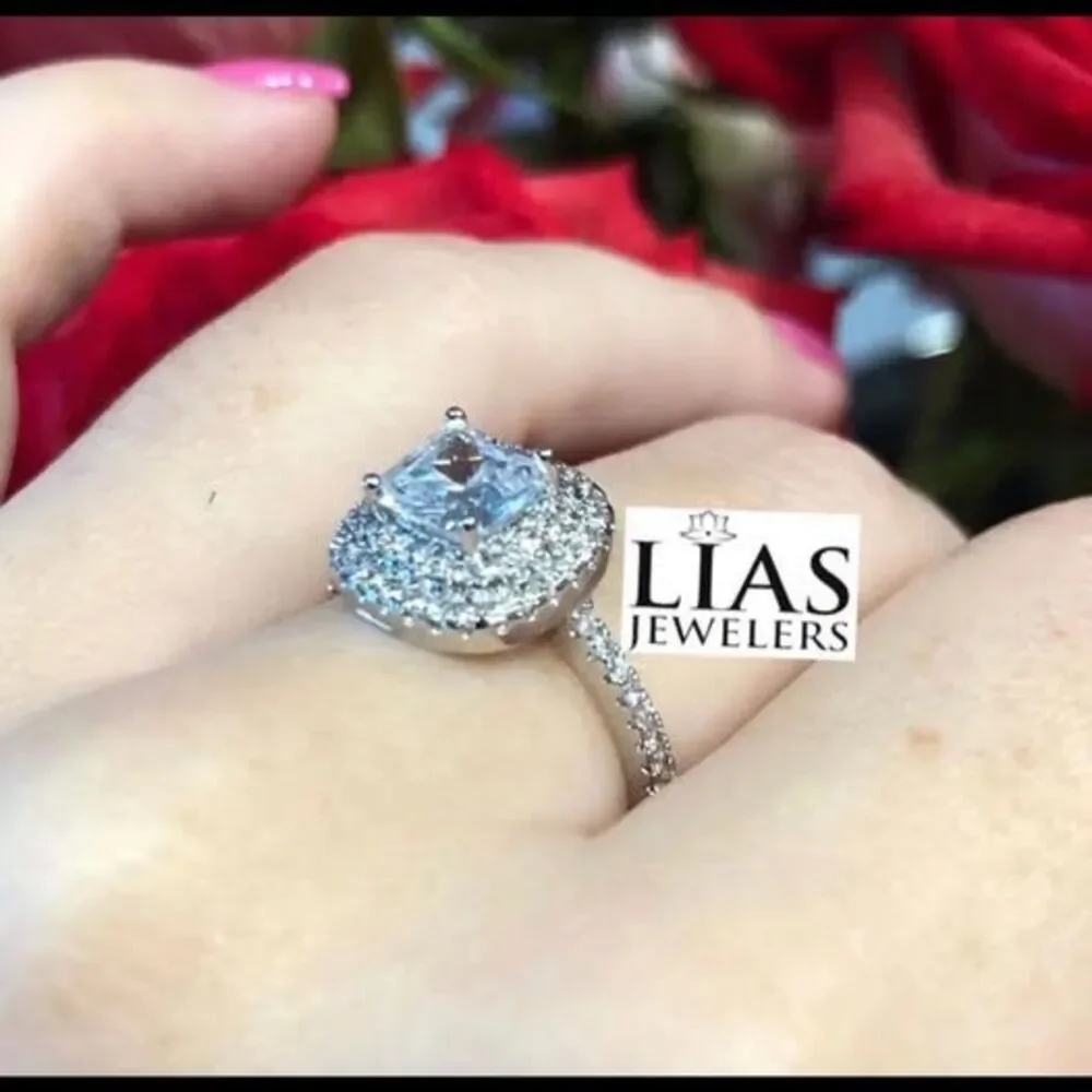 New 18k white gold engagement ring